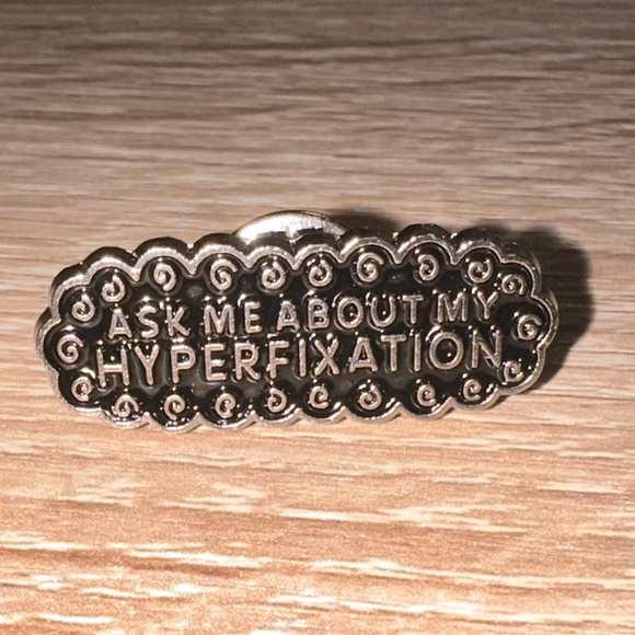 “Ask Me About My Hyperfixation” Swirly Metal Pin - Picture 2 of 4